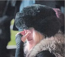  ??  ?? Walk Off The Earth's Sarah Blackwood wipes tears as she watches a video tribute to band mate Mike Taylor.