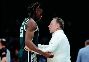  ?? JUNFU HAN/DETROIT FREE PRESS ?? Michigan State head coach Tom Izzo talks to forward Coen Carr during the second half of Saturday’s loss to UNC in the NCAA tournament. Izzo after the game: “I’ve got to do a better job. I’m really disappoint­ed with me.”