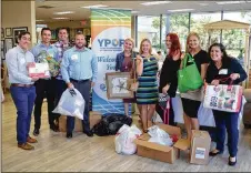  ??  ?? Young Profession­als of The Palm Beaches collecting clothing and home goods for the Hospice Resale Shop.
