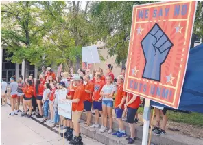  ?? JIM THOMPSON/JOURNAL ?? UNM student-athletes from some of the sports that could be cut at today’s Board of Regents meeting attend a rally Thursday night.