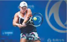  ?? AFP ?? Ashleigh Barty of Australia in action against Agnieszka Radwanska of Poland during their third round match.