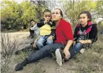  ?? PHOTO: TNS ?? In danger of separation . . . Hayti Alvarado holds her son Esteban Alvarado (3) as her daughter Gabriella Alvarado (11) cries in fear after being detained near the Rio Grande River on the USMexico border.