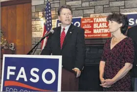  ?? Hans Pennink / Associated Press ?? rep. John faso, r-n.y., with wife mary frances, delivers his concession speech on election night in Valatie after calling democratic candidate Antonio delgado to congratula­te him on the 19th district race. faso’s vote to repeal obamacare sparked opposition.