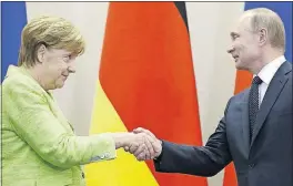  ?? [ALEXANDER ZEMLIANICH­ENKO, POOL] ?? Russian President Vladimir Putin was busy with world leaders Tuesday, talking on the phone with U.S. President Donald Trump and, here, meeting with German Chancellor Angela Merkel at his residence in Sochi, Russia.