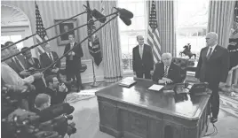  ?? PABLO MARTINEZ MONSIVAIS/AP ?? President Donald Trump, flanked by Health and Human Services Secretary Tom Price (left) and Vice President Mike Pence, talks about the GOP health care bill Friday at the White House.