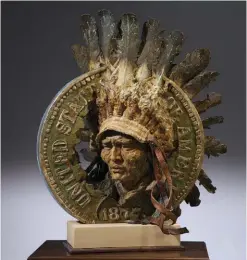  ??  ?? Greg Woodard, Indian Head
Penny, bronze,
66 x 30 x 18”. The Booth Western Art Museum permanent collection.