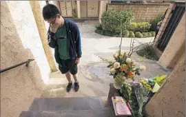  ?? Irfan Khan
Los Angeles Times ?? JUSTIN TSOU, a friend of William Lin, weeps outside the Lin family’s Arcadia town home. They had volunteere­d together at Methodist Hospital.