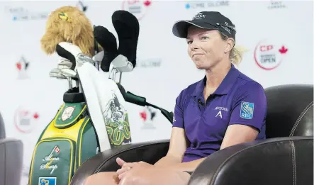  ?? MICHAEL BELL / THE CANADIAN PRESS ?? Alena Sharp speaks to media at the LPGA’s CP Women’s Open at Wascana Country Club in Regina on Tuesday. She’ll be playing with a Humboldt Broncos-themed golf bag for the tournament.