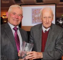  ??  ?? Enda O’Connor, BOM, makes presentati­on to founder member, Joe Sheehan, at the Gorey Credit Union 50th anniversar­y dinner in the Ashdown Park Hotel.