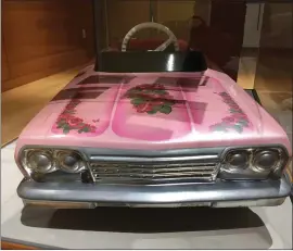  ?? PHOTOS BY SAL PIZARRO — STAFF ?? A remote control car made for a child to ride in owned by artist Ricardo Cortez is one of the pieces on display at the new exhibition on San Jose’s Lowrider Culture at the Dr. Martin Luther King Jr. Main Library.