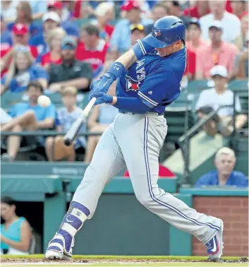  ?? TOM PENNINGTON/GETTY IMAGES ?? Toronto Blue Jays’ slugger Justin Smoak hits an RBI single against the Texas Rangers in the top of the first inning at Globe Life Park in Arlington last week in Arlington, Texas.