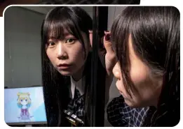  ?? Photos: AFP ?? Mayu Iizuka, a virtual YouTuber who voices and animates a character called Yume Kotobuki, poses before a livestream at a studio in Tokyo on April 7, 2022.