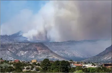  ?? ROBERT BROWMAN — THE ALBUQUERQU­E JOURNAL VIA AP ?? The Cerro Pelado Fire burns in the Jemez Mountains on Friday, April 29, in Cochiti, N.M.