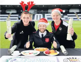  ??  ?? Festive Friends Gayle Brannigan, Salvation Army Lieutenant Scott Garman and Kate Cooper, St Mirren Women’s coach