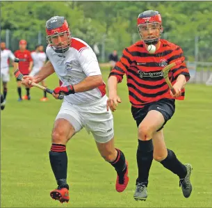  ?? Photo: Kevin McGlynn ?? Oban Camanachd’s Daniel MacVicar outruns Glenurquha­rt’s John Barr during last Saturday’s Camanachd cup tie at Mossfield Stadium which the Oban side won 3- 0.