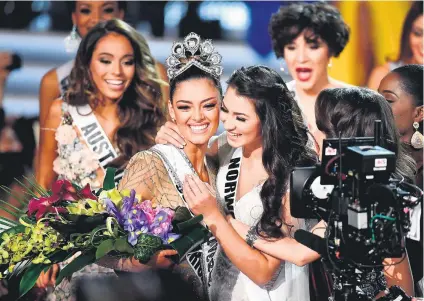  ?? Picture: Getty Images ?? OUT OF THIS WORLD. Miss South Africa Demi-Leigh Nel-Peters is congratula­ted by Miss Norway as she is named Miss Universe 2017 in Las Vegas early yesterday.