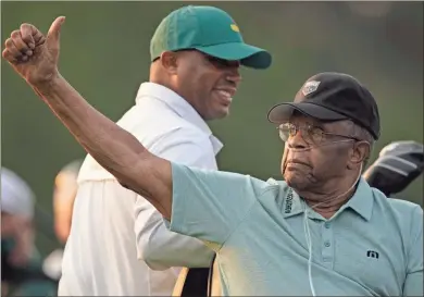  ?? Ap-charlie Riedel ?? Lee Elder gestures as he arrives for the ceremonial tee shots before the first round of the Masters golf tournament in Augusta on Thursday.