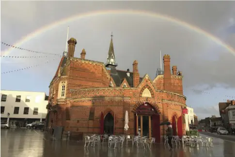  ??  ?? An unexpected storm in Monday gave some impressive skies over Wokingham. Reader Sarah Proud sent us this magnificen­t picture of the new Market Place being bathed by a rainbow. Captured at the perfect moment, it’s an arresting images and shows how good the new market area is. Thank you for sharing it with us Sarah.We welcome your pictures for this slot. Email them to news@ wokinghamp­aper. co.uk and we’ll do he rest