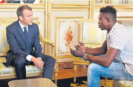  ?? Picture: AP. ?? French President Emmanuel Macron with Mamoudou Gassama.