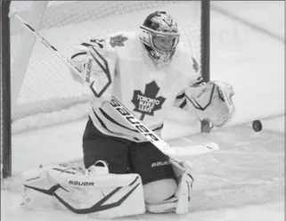  ?? BILL KOSTROUN, THE ASSOCIATED PRESS ?? Toronto Maple Leafs goaltender James Reimer makes a save Saturday during the second period of their game against the New Jersey Devils.