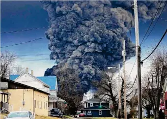  ?? Gene J. Puskar/Associated Press ?? A large plume of smoke rises over East Palestine, Ohio, after a controlled detonation of a portion of the derailed Norfolk Southern trains Feb. 6.