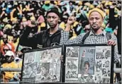  ?? GULSHAN KHAN/GETTY-AFP ?? Mourners watch from the stands of the Orlando Stadium in Soweto during the funeral of the late anti-apartheid champion Winnie Mandizikel­a-Mandela.