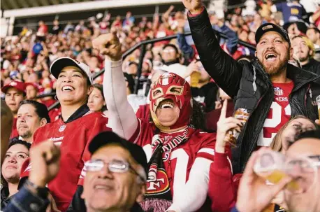  ?? Photos by Alicia Vera/Special to The Chronicle ?? The 78,427 folks at Estadio Azteca in Mexico City on Monday night were almost entirely 49ers fans, including Marilyn Chavez, below right, who had her face painted in 49ers colors. “It was electric,” quarterbac­k Jimmy Garoppolo said of the scene.