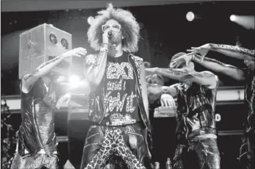  ??  ?? SINGLED OUT: In this 2011 file photo, singer Redfoo, center, and LMFAO perform at Z100’ s Jingle Ball concert at Madison Square Garden in New York. When LMFAO released its sophomore album, “Sorry for Party Rocking,” it only sold 27,000 units in its...