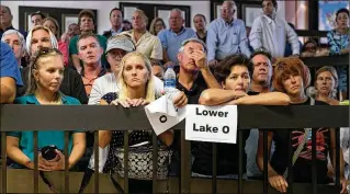  ?? GREG LOVETT / THE PALM BEACH POST ?? People stand in the overflow area at Stuart City Hall on Friday during a public forum with the Army Corps, South Florida Water Management District and Rep. Brian Mast to discuss the algae outbreaks in South Florida and the projects planned to alleviate them.