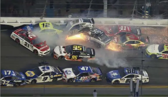  ?? JIM TOPPER — THE ASSOCIATED PRESS ?? Multiple cars crash during a NASCAR Daytona 500 Sunday at Daytona Internatio­nal Speedway.