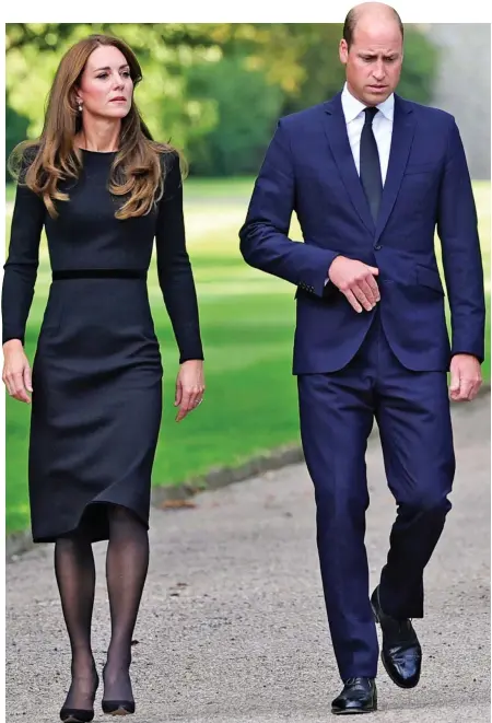  ?? ?? Reunited to honour the Queen: The new Prince and Princess of Wales and the Duke and Duchess of Sussex go to view the flowers and greet crowds outside Windsor Castle on Saturday afternoon