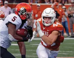  ?? Associated Press ?? In this Oct. 21 file photo, Texas linebacker Breckyn Hager (44) pursues Oklahoma State running back Justice Hill (5) during the first half of an NCAA college football game in Austin. Texas plays at No. 24 West Virginia today. When asked about what...