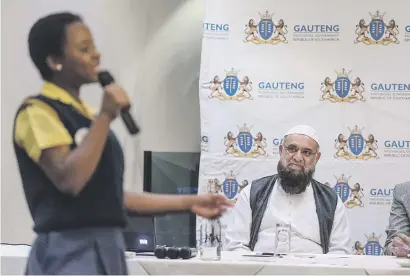  ?? Picture: Yeshiel Panchia ?? FOOD FOR THOUGHT. Gauteng MEC for roads and transport Ismail Vadi listens to a poetry reading by Grade 7 pupil Tinyiso Baloyi at the Transport Career Day for High Schools in Tshwane yesterday.