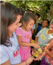  ??  ?? Little girl smiling “paglaum”—it’s Visayan for hope.