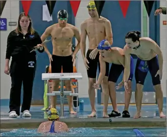  ?? ?? East Boston High School’s team cheers on their swimmer during the Boston City League co-ed swimming championsh­ip on Thursday.