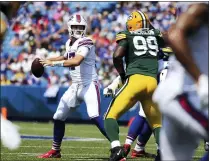  ?? JEFFREY T. BARNES - THE ASSOCIATED PRESS ?? Buffalo Bills quarterbac­k Josh Allen (17) looks to pass while pressured by Green Bay Packers defensive tackle Willington Previlon (99) during the first half of a preseason NFL football game, Saturday, Aug. 28, 2021, in Orchard Park, N.Y.