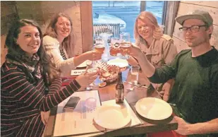  ?? WISCONSIN FOODIE ?? Jennifer Ede (from left), former publisher of Edible Milwaukee; Jamie Lamonde, publisher of Edible Madison; Wendi Devan and Arthur Ircink, the new publishers of Edible Milwaukee, share a toast.