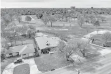  ??  ?? Aerial view of updated 1736 NW 63, Nichols Hills, built in 1951 next door to the Oklahoma City Golf & Country Club, listed for $474,900 with Jennifer Kragh with Sage Sotheby's Internatio­nal Realty. [PHOTO PROVIDED]