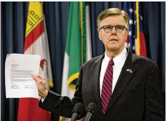  ?? DEBORAH CANNON / AMERICAN-STATESMAN ?? Lt. Gov. Dan Patrick holds up a letter about property tax relief Wednesday during a news conference at the Capitol. Patrick said the Senate will not act on legislatio­n keeping some state agencies operating unless the House passes two of his legislativ­e priorities.