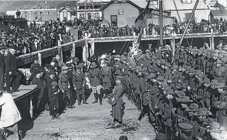  ?? TASMAN BAYS HERITAGE TRUST/NELSON PROVINCIAL MUSEUM, TYREE STUDIO, 181592/3 ?? Soldiers of the 12th Nelson/Marlboroug­h Regiment prepare to board a ship at Port Nelson as they leave to join the fighting in World War I. The war ended with an exhausted Germany signing an armistice, but the outcome could have been very different.