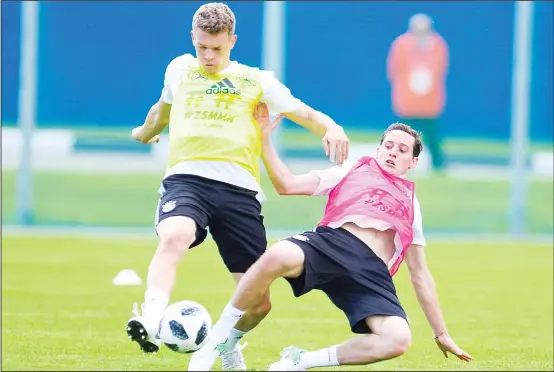  ??  ?? Germany’s defender Matthias Ginter (left), and forward Sebastian Rudy vie for the ball during a training session in Vatutinki, near Moscow, on June 13, ahead of the Russian 2018 World Cup
football tournament. (AFP)