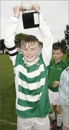  ??  ?? Greystones captain Callum Archer lifts the cup.