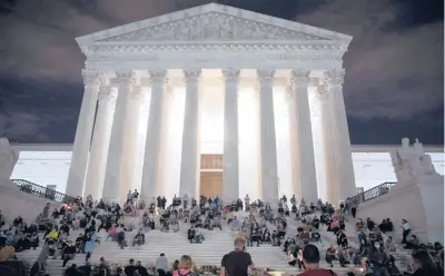  ?? TASOS KATOPODIS/GETTY 2020 ?? People mourn the death of Supreme Court Justice Ruth Bader Ginsburg in front of the Supreme Court.