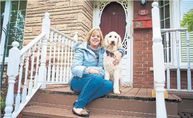  ?? MICHEL VILLENEUVE THE TORONTO STAR ?? Lisa Nagy, with Lucy, at one of her St. Catharines’ houses. Nagy’s investment strategy is property ownership.