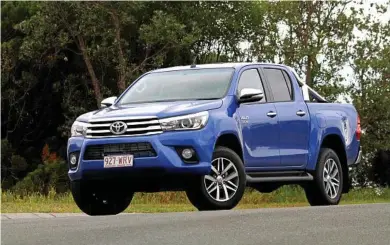  ?? PHOTOS: IAIN CURRY ?? FIRM FAVOURITE: The Toyota HiLux SR5 is a hugely popular buy in Australia, but be warned the ride isn’t the best without some weight in the tray. Brakes and fuel economy are worthy of praise, but some cabin features could be improved.