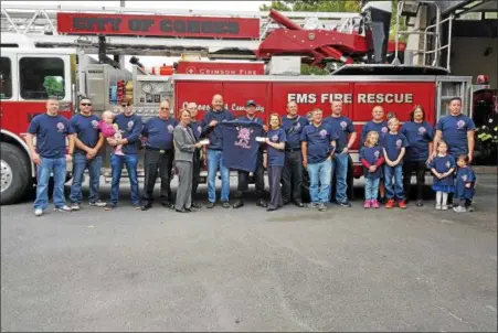  ?? PHOTO PROVIDED ?? Members of the Cohoes Fire Department pose in October 2016with family members while wearing pink T- shirts sold as part of Uniformed Firefighte­rs of Cohoes Local 2562’ s annual Passionate­ly Pink campaign against breast cancer. This year’s campaign...