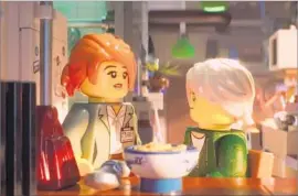  ?? Warner Bros. Pictures ?? KOKO (at left, voiced by Olivia Munn) with Lloyd (Dave Franco) in “Lego” film.