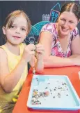  ??  ?? CREATIVE: Lilliana Hopkinson and Christine Hopkinson enjoy a special kids' area at Atherton attraction The Crystal Caves.