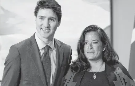  ?? SEAN KILPATRICK
CP ?? Prime Minister Justin Trudeau and Veterans Affairs Minister Jodie Wilson-Raybould attend a swearing in ceremony at Rideau Hall in Ottawa on Jan. 14. Veterans Affairs Minister Wilson-Raybould is quitting the federal cabinet. •