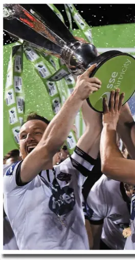  ??  ?? From left Stephen O’Donnell lifts the FAI Cup in 2015, the League title in John Mountney after last year’s league success.